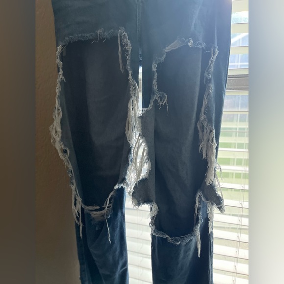 Very distressed denim jeans, light and airy lol. They’re very cute w fishnets!! - Picture 3 of 4